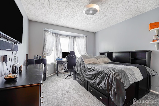 40 Nathan Dr, Old Bridge, NJ 08857 - bedroom featuring carpet floors, a textured ceiling, and an office area