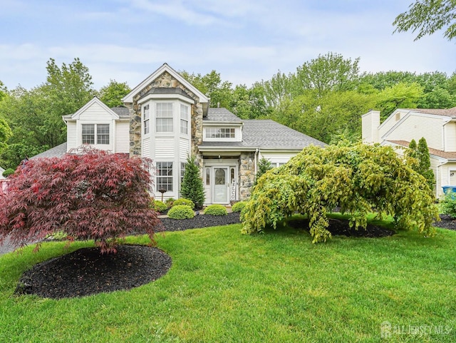40 Nathan Dr, Old Bridge, NJ 08857 - victorian home with stone siding, a front lawn, and a shingled roof