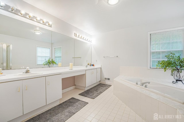 40 Nathan Dr, Old Bridge, NJ 08857 - full bath with double vanity, a bath, and tile patterned floors