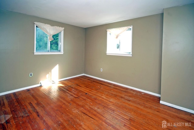 empty room featuring hardwood / wood-style flooring