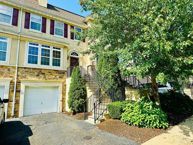 townhome / multi-family property featuring a garage