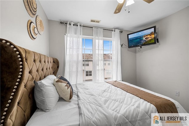 bedroom featuring visible vents and ceiling fan