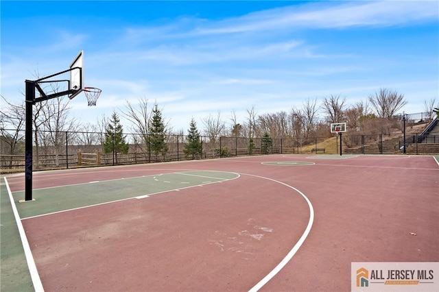 view of sport court featuring community basketball court and fence