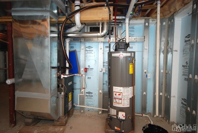 utility room with gas water heater