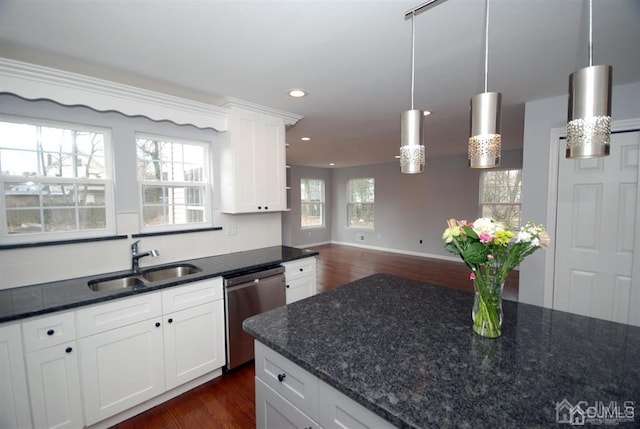 kitchen with sink, stainless steel dishwasher, a wealth of natural light, and dark hardwood / wood-style floors