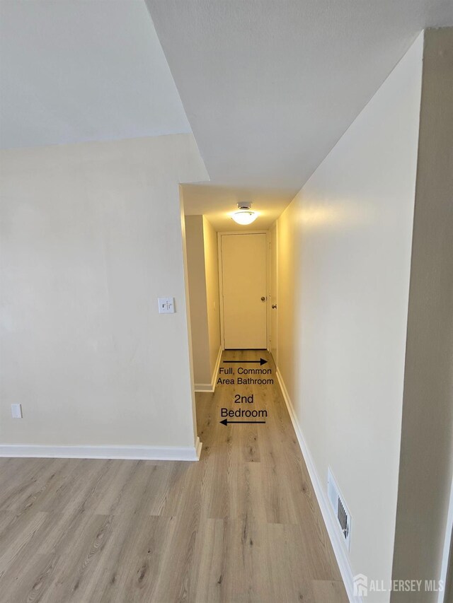 corridor featuring light wood-type flooring