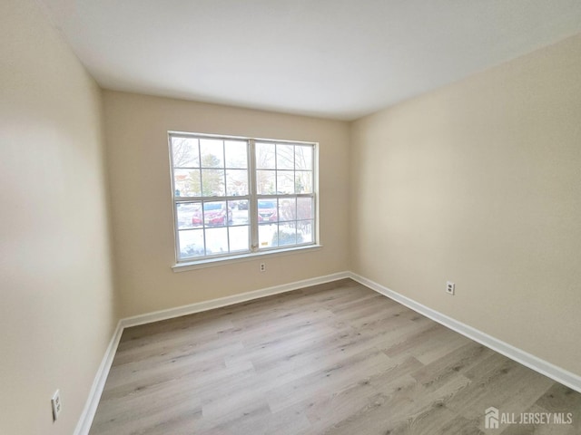 empty room with light wood-type flooring