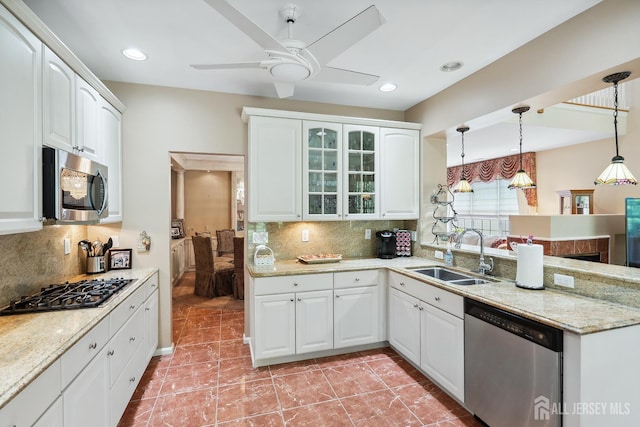 267 Tyler Ct, Monroe, NJ 08831 - kitchen with stainless steel appliances, a peninsula, ceiling fan, glass insert cabinets, and tasteful backsplash