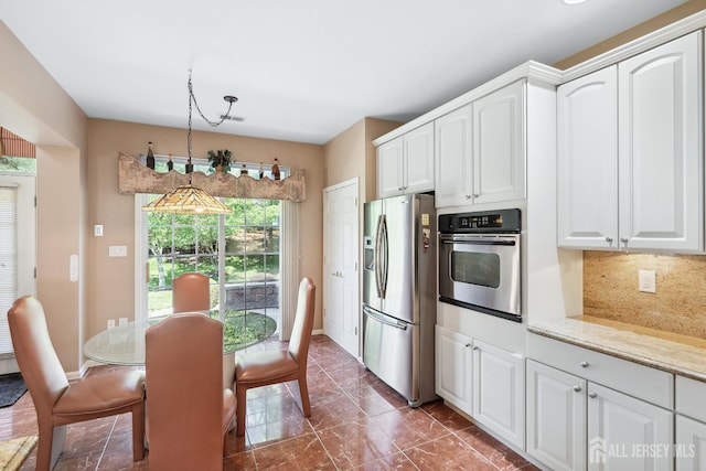267 Tyler Ct, Monroe, NJ 08831 - kitchen featuring stainless steel appliances, decorative backsplash, white cabinets, and dark marble finish floors