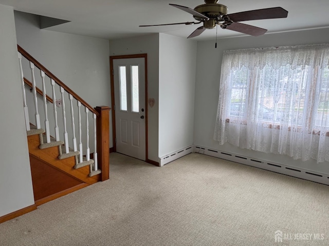 161 Manor St, South Amboy, NJ 08879 - carpeted entrance foyer featuring ceiling fan, baseboard heating, and stairs