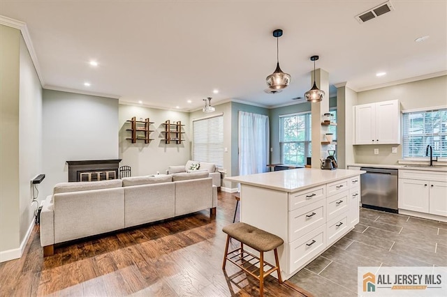 4211 Bayberry Ct, South Brunswick, NJ 08852 - kitchen featuring stainless steel dishwasher, crown molding, recessed lighting, white cabinetry, and light countertops