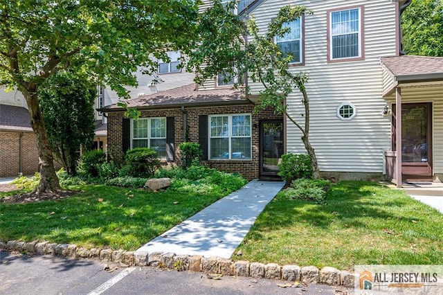 4211 Bayberry Ct, South Brunswick, NJ 08852 - view of front of home featuring a front lawn, brick siding, uncovered parking, and a shingled roof