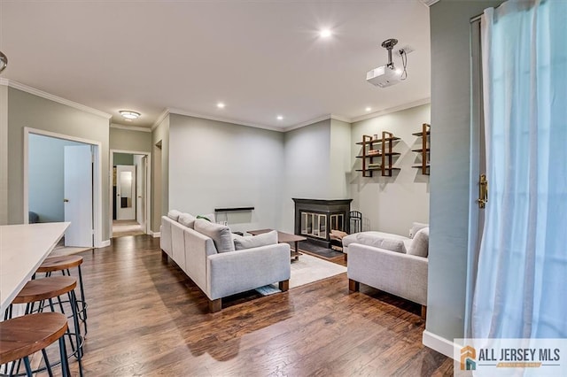 4211 Bayberry Ct, South Brunswick, NJ 08852 - living room featuring dark wood-style floors, recessed lighting, ornamental molding, and a glass covered fireplace