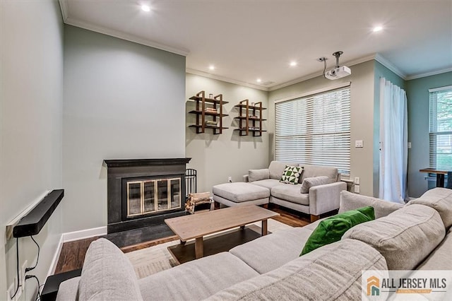 4211 Bayberry Ct, South Brunswick, NJ 08852 - living area with wood finished floors, recessed lighting, crown molding, and a glass covered fireplace