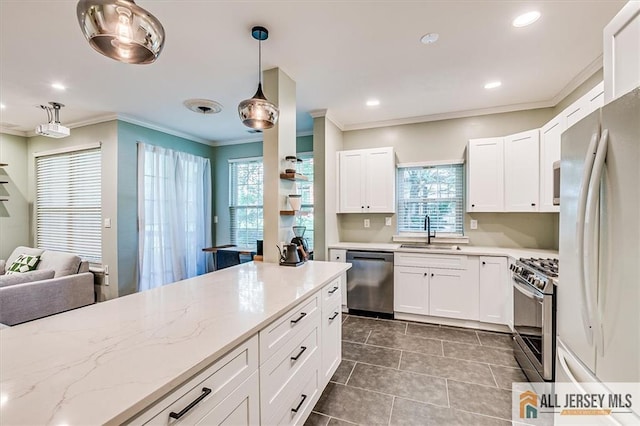 4211 Bayberry Ct, South Brunswick, NJ 08852 - kitchen featuring stainless steel appliances, crown molding, dark tile patterned floors, decorative light fixtures, and white cabinetry