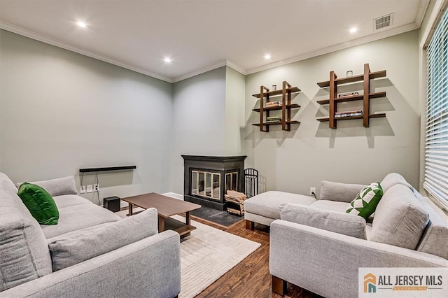 4211 Bayberry Ct, South Brunswick, NJ 08852 - living area featuring dark wood-style flooring, recessed lighting, crown molding, and a fireplace with flush hearth