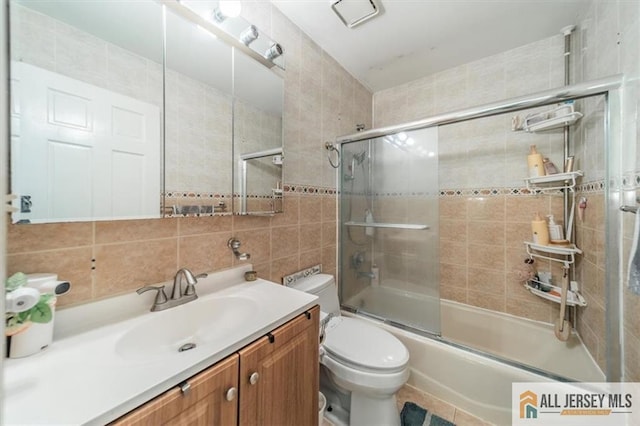 47 Pheasant Run Unit 47, Edison, NJ 08820 - bathroom featuring vanity, shower / bath combination with glass door, tile walls, and decorative backsplash
