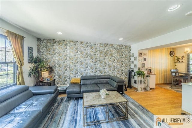 47 Pheasant Run Unit 47, Edison, NJ 08820 - living room with wood finished floors, an accent wall, wallpapered walls, and recessed lighting