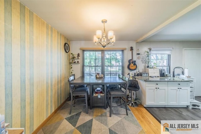47 Pheasant Run Unit 47, Edison, NJ 08820 - dining room with a chandelier, wallpapered walls, and light wood finished floors