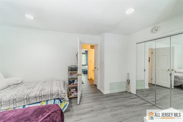 47 Pheasant Run Unit 47, Edison, NJ 08820 - bedroom featuring a closet, wood finished floors, and recessed lighting