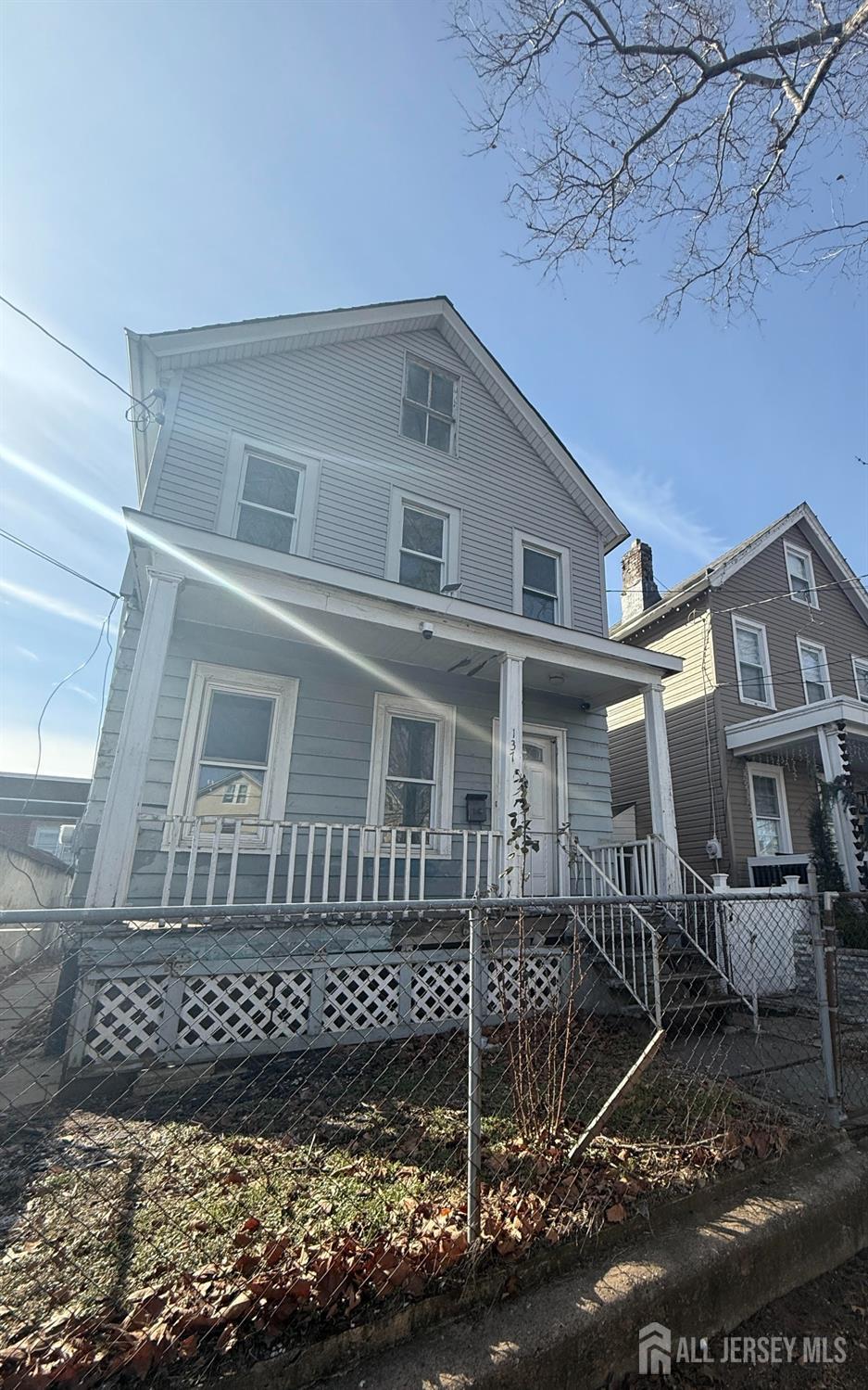 137 William St, Perth Amboy, NJ 08861 - american foursquare style home featuring covered porch