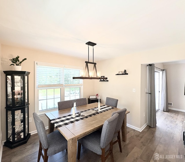 122 Arbor Way, Branchburg, NJ 08876 - dining area with a chandelier, dark wood-type flooring, and baseboards