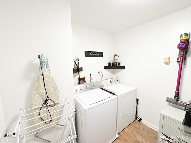 122 Arbor Way, Branchburg, NJ 08876 - laundry area with washer and dryer, light wood-style floors, and baseboards