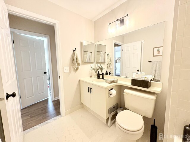 122 Arbor Way, Branchburg, NJ 08876 - bathroom with toilet, vanity, and tile patterned flooring