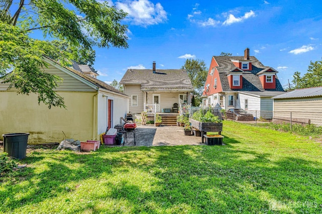 305 Penfield Pl, Dunellen, NJ 08812 - back of property with a patio, a chimney, and stucco siding