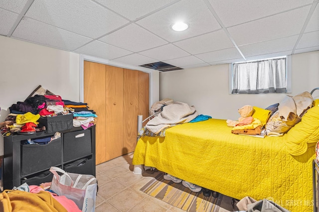 305 Penfield Pl, Dunellen, NJ 08812 - bedroom featuring light tile patterned floors, a drop ceiling, a closet, and recessed lighting