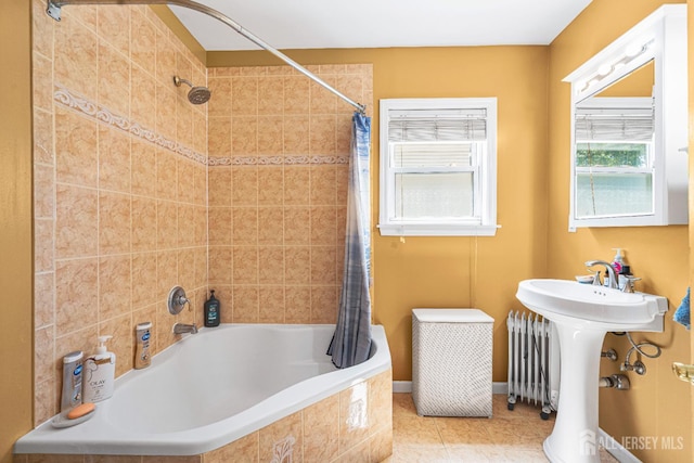 305 Penfield Pl, Dunellen, NJ 08812 - full bath featuring tiled shower / bath combo, radiator heating unit, and tile patterned flooring
