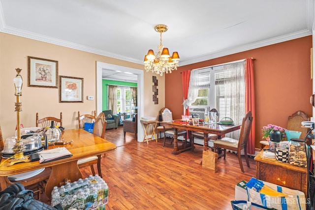 305 Penfield Pl, Dunellen, NJ 08812 - dining room featuring a chandelier, light wood-style floors, and ornamental molding