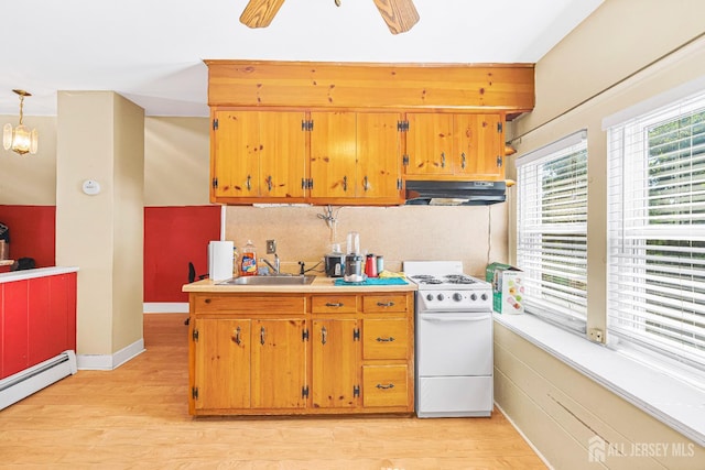 305 Penfield Pl, Dunellen, NJ 08812 - kitchen with white electric range, under cabinet range hood, a baseboard heating unit, light wood finished floors, and light countertops
