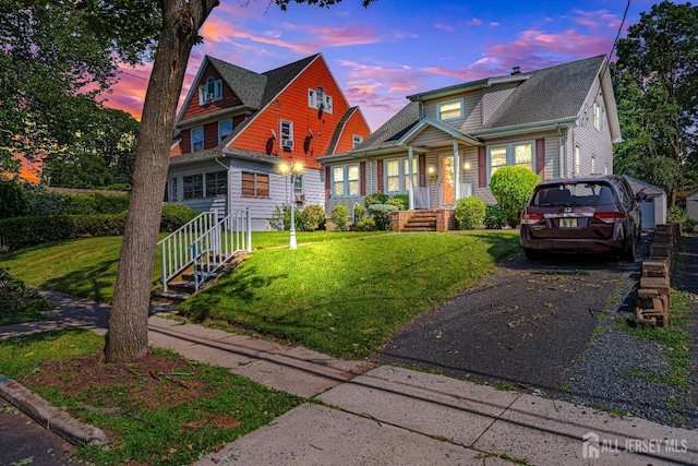 305 Penfield Pl, Dunellen, NJ 08812 - view of front of home with asphalt driveway and a front lawn