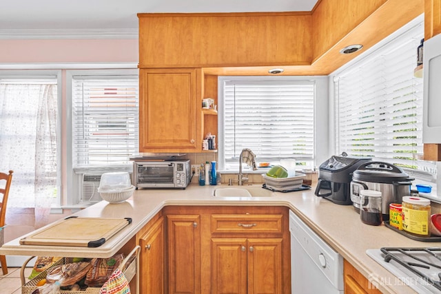 305 Penfield Pl, Dunellen, NJ 08812 - kitchen featuring white appliances, light countertops, plenty of natural light, crown molding, and brown cabinetry