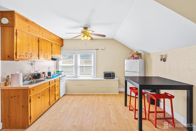 305 Penfield Pl, Dunellen, NJ 08812 - kitchen with white appliances, ceiling fan, light wood-type flooring, vaulted ceiling, and light countertops