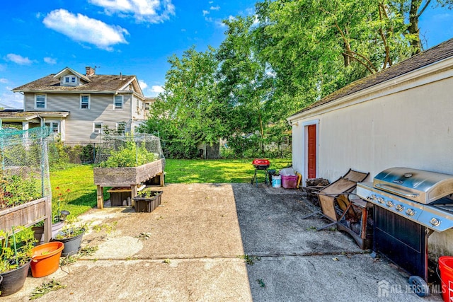 305 Penfield Pl, Dunellen, NJ 08812 - view of patio with a garden and a grill