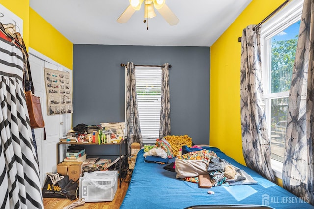 305 Penfield Pl, Dunellen, NJ 08812 - bedroom featuring multiple windows, wood finished floors, and ceiling fan