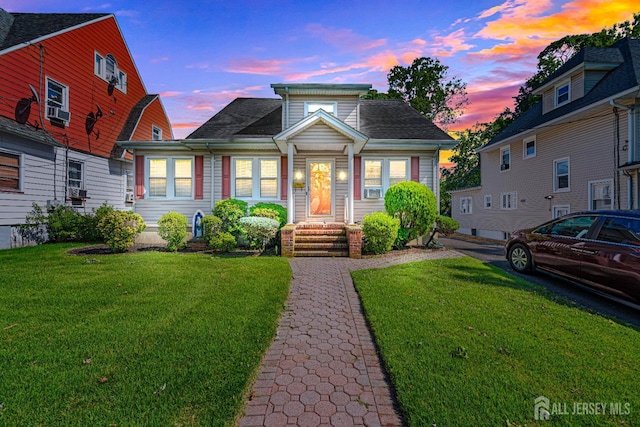 305 Penfield Pl, Dunellen, NJ 08812 - bungalow-style house featuring a lawn