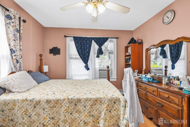 305 Penfield Pl, Dunellen, NJ 08812 - bedroom with wood finished floors, a ceiling fan, and cooling unit