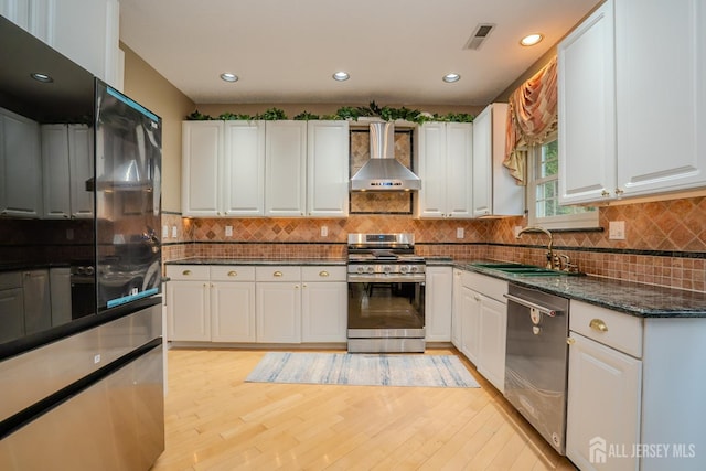 5 Fairmount Ct, Monroe, NJ 08831 - kitchen featuring wall chimney exhaust hood, appliances with stainless steel finishes, white cabinets, and recessed lighting