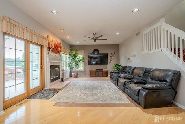 5 Fairmount Ct, Monroe, NJ 08831 - living room with recessed lighting, a ceiling fan, wood finished floors, a fireplace with flush hearth, and stairway