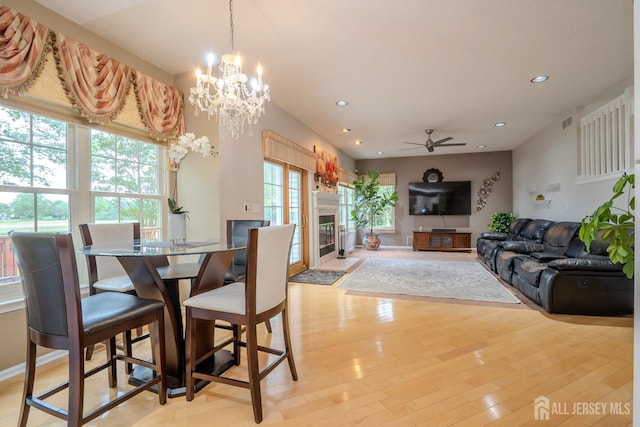 5 Fairmount Ct, Monroe, NJ 08831 - dining room featuring a fireplace with flush hearth, recessed lighting, a ceiling fan, light wood-style flooring, and a chandelier