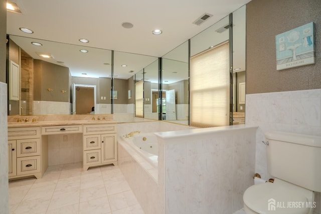 5 Fairmount Ct, Monroe, NJ 08831 - full bathroom featuring a whirlpool tub, vanity, tile walls, recessed lighting, and tile patterned flooring