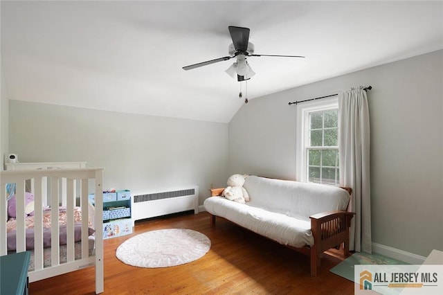 241 E Chestnut Ave, Metuchen, NJ 08840 - bedroom with radiator heating unit, lofted ceiling, wood finished floors, baseboards, and ceiling fan