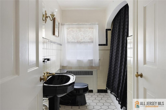 241 E Chestnut Ave, Metuchen, NJ 08840 - full bathroom featuring toilet, tile walls, radiator, tile patterned floors, and a shower with shower curtain