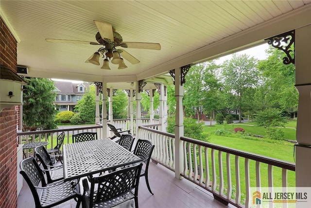 241 E Chestnut Ave, Metuchen, NJ 08840 - wooden terrace featuring ceiling fan, a lawn, and outdoor dining area