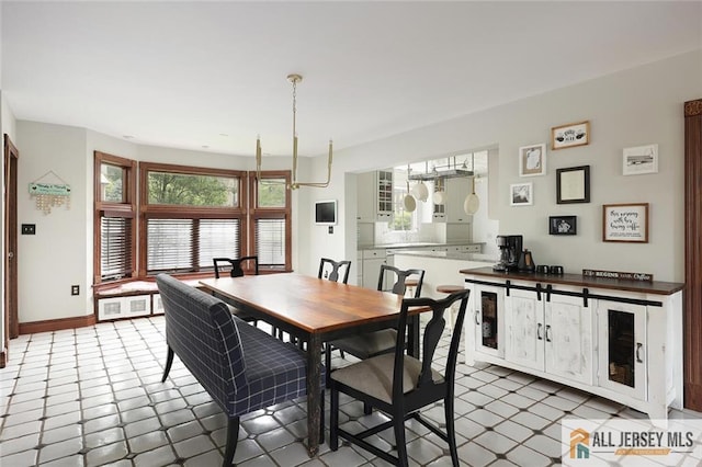 241 E Chestnut Ave, Metuchen, NJ 08840 - dining area with plenty of natural light and baseboards