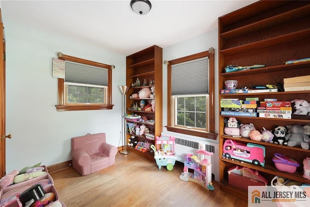 241 E Chestnut Ave, Metuchen, NJ 08840 - rec room featuring wood finished floors and baseboards