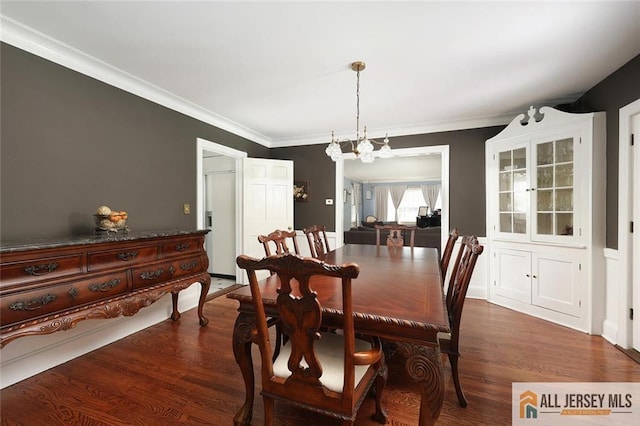 241 E Chestnut Ave, Metuchen, NJ 08840 - dining space with dark wood-style floors, a chandelier, and ornamental molding
